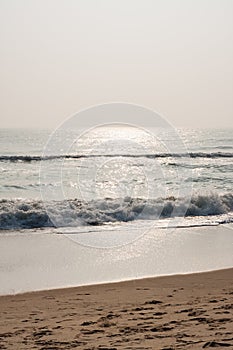 Glistening waves on beach