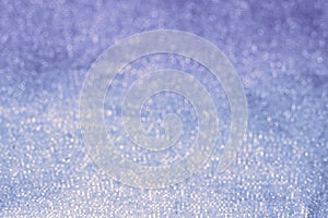 Glitter blue texture sparkling paper background. Abstract twinkled blue glittering background with bokeh, defocused lights for