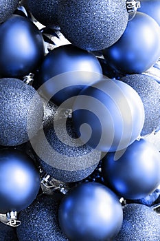 Glitter Christmas balls blue background. Holiday decoration.