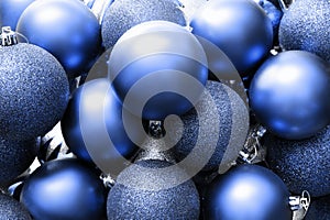 Glitter Christmas balls blue background. Holiday decoration