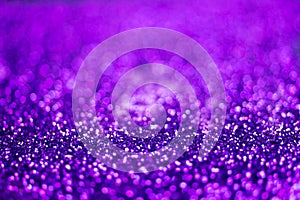 Glitter light abstract purple bokeh light background
