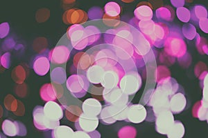 Glitter lights background. Holiday bokeh texture. Multicolored light. Defocused Christmas and xmas background.