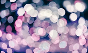 Glitter lights background. Holiday bokeh texture. Multicolored light. Defocused Christmas and xmas background.