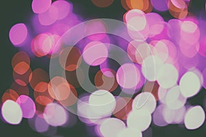 Glitter lights background. Holiday bokeh texture. Multicolored light. Defocused Christmas and xmas background.