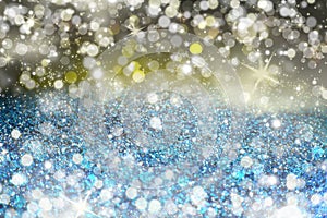 Glitter lights blue grunge background. Glitter defocused abstract Twinkly Lights and Stars Christmas Background