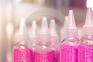 Glitter in plastic bottles. Decorative sequins to give shine