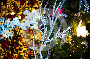 Glitter red ball celebrate christmas on tree with wire white light vignette background