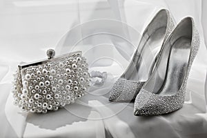 Glitter silver shoes and clutch bag