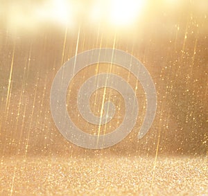 Glitter vintage lights background. abstract gold background . defocused