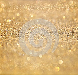 Glitter vintage lights background. abstract gold background . defocused