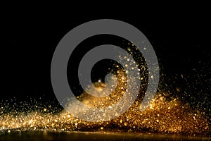 Glitter vintage lights background. gold and black. de focused