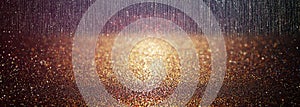 Glitter vintage lights background. gold and black. defocused