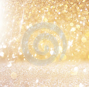 Glitter vintage lights background. light gold and black. defocused