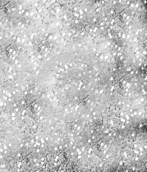 Glitter vintage lights background. light grey . defocused.