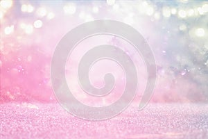 glitter vintage lights background. pink and purple. de-focused.