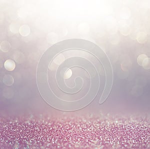 Glitter vintage lights background. pink, white and purple. defocused