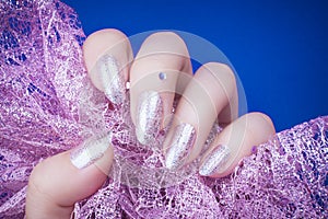 Glittered nails manicure