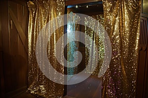 glittering foil curtains in doorway, no attendees