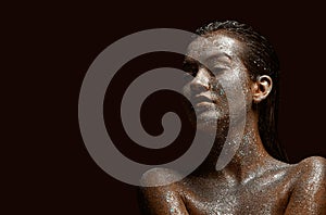 Glittering silver female body art, young beautiful naked girl with wet hair, skin in sparkles, copy space