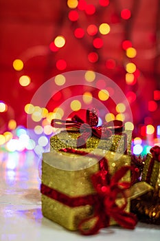 Glittery Christmas gifts. Christmas decorations on blurred lights background