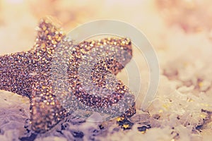 Glittery star with bright background in soft look with copy space