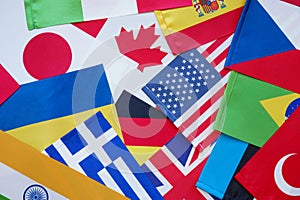 Global citizenship and Multilateralism. Many small flags of different countries.