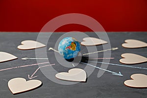 Global communication and networking. Internet or online dating, sharing and social media. Globe and figures of hearts