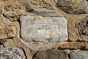 Global election year 2024 symbol. Concept words Global election year 2024 on beautiful big grey stone. Beautiful stone wall