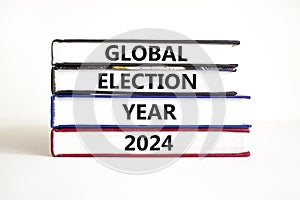 Global election year 2024 symbol. Concept words Global election year 2024 on beautiful books. Beautiful white table white