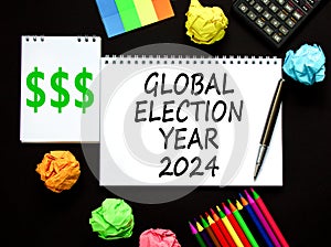 Global election year 2024 symbol. Concept words Global election year 2024 on beautiful white note. Beautiful black table