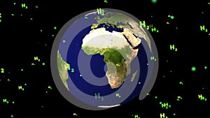 Global with green H2 text particles flying meaning green hydrogen all world