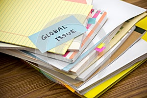 Global Issue; The Pile of Business Documents on the Desk