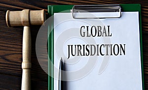 GLOBAL JURISDICTION - words on a white sheet with a judge\'s gavel