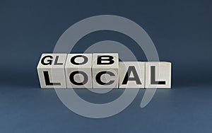 Global or Local. The cubes form the choice words Global or Local