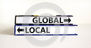 Global or local symbol. Concept word Global or Local on beautiful books. Beautiful white table white background. Business and