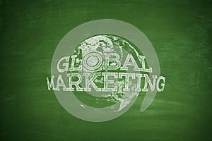 Global marketing concept on blackboard