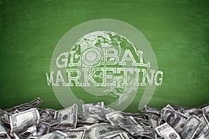 Global marketing concept on blackboard