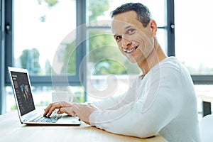 Cheerful intelligent man working