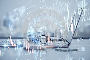 Global trading and stock market concept with foggy digital interface with world map and forex market indicators and candlesticks