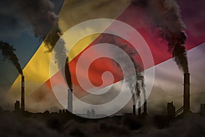 Global warming concept - dense smoke from industrial chimneys on Seychelles flag background with space for your logo - industrial