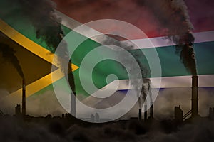 Global warming concept - dense smoke from industry pipes on South Africa flag background with place for your content - industrial