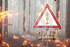 Global Warming warning sign in a burning forest