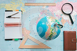 Globe on the background of the world map.