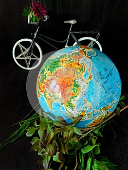 Globe and a bicycle. Travel concept. Environment concept