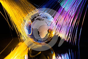 Glass Globe against Fiber Optic Background