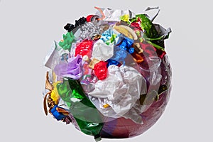 A globe of the earth with trash over white background, the concept of ecology problem