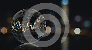 Globe with financial graph overlayed on a blurred city background at night. photo
