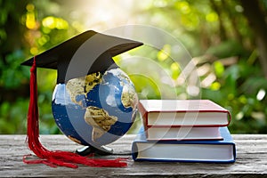 Globe with graduation cap and books on white banner background, education and global learning