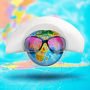 Globe with hat and pink sunglasses