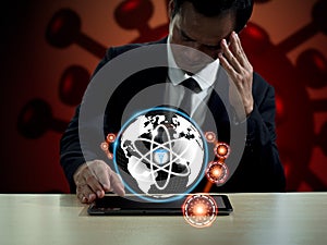 The globe with health symbols and the Corona virus frightens businesspeople. The idea is to confront the world's rising